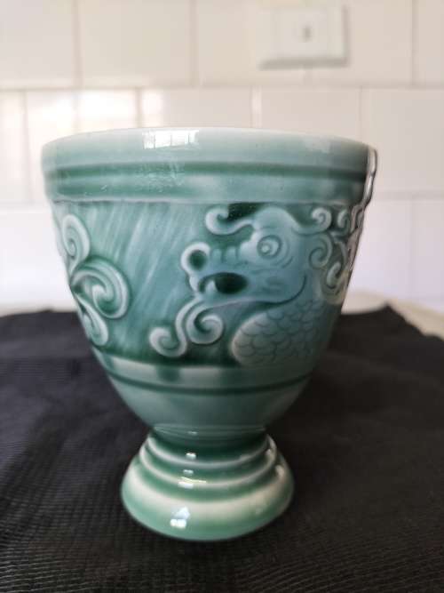 A CERAMIC JADE COLOURED CALEDON LIKE, GOBLET.- NO MARKINGS.