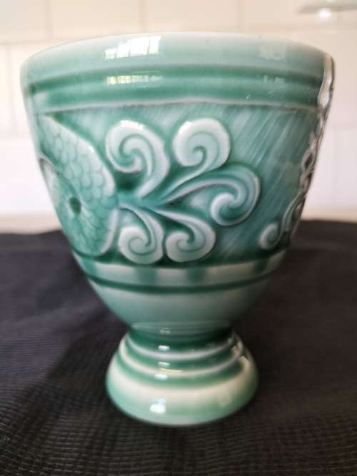 A CERAMIC JADE COLOURED CALEDON LIKE, GOBLET.- NO MARKINGS.