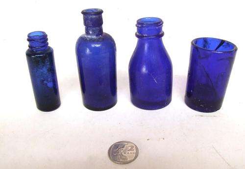BLUE GLASS: Collection of 3 bottles and one medicine glass in good condition