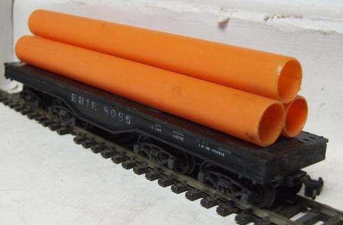 LIMA HO: Freight Wagon with Extra Heavy Pipe load in fair used unboxed condition(Made in Italy)