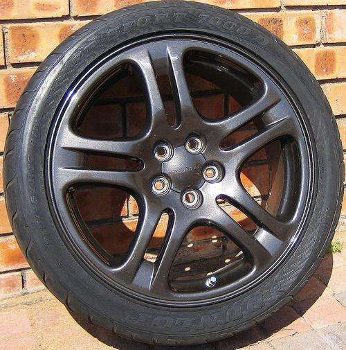 SET (4) SUBARU WRX SPECIAL EDITION MAG RIMS. NO SCRATCHES OR DENTS