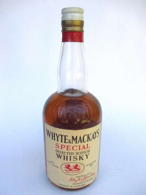 VINTAGE WHYTE & MACKAYS WHISKEY BOTTLE STILL SEALED (BAR)