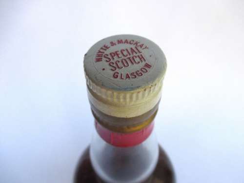 VINTAGE WHYTE & MACKAYS WHISKEY BOTTLE STILL SEALED (BAR)