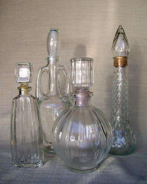 4 VINTAGE PRESSED GLASS DECANTERS