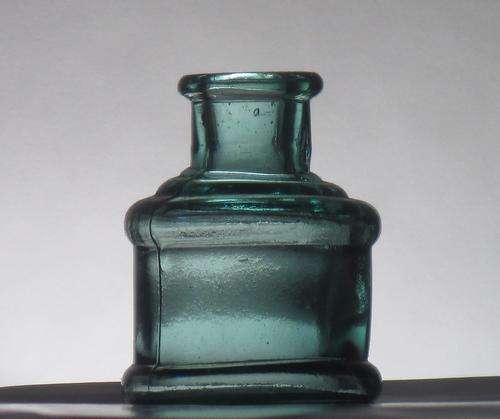 ANTIQUE COTTON WHEEL INK BOTTLE