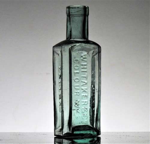 ANTIQUE WHITAKER and Co COLOUR WKS BOTTLE