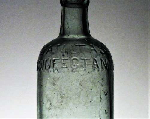 ANTIQUE SANITAS DISINFECTANT BOTTLE WITH APLIEDLIP