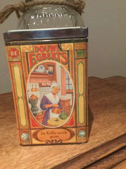 Vintage Douwe Egberts coffee tin depicting lady serving coffee made in holland