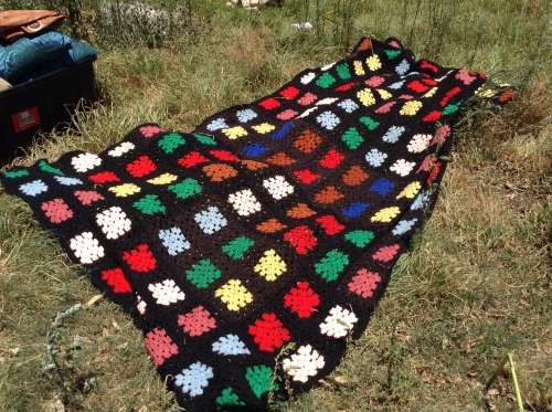 Black with coloured blocks long crochet blanket