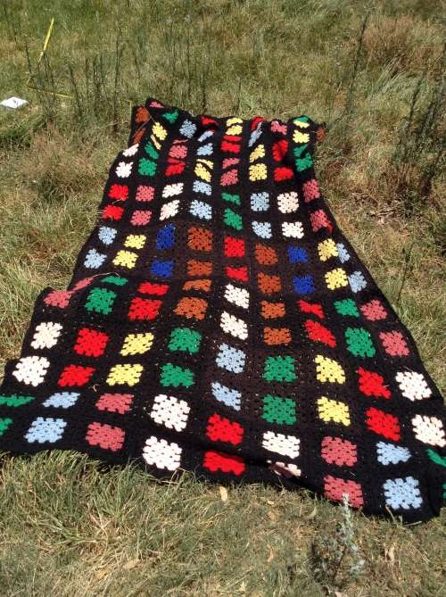 Black with coloured blocks long crochet blanket