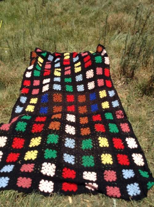 Black with coloured blocks long crochet blanket