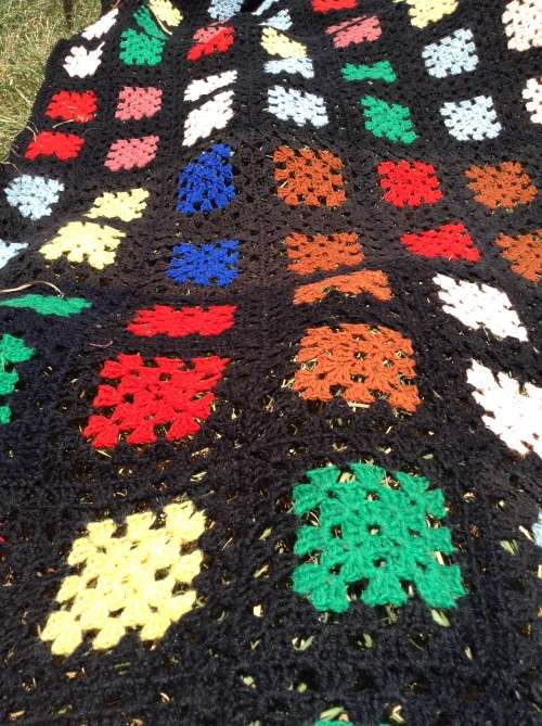 Black with coloured blocks long crochet blanket
