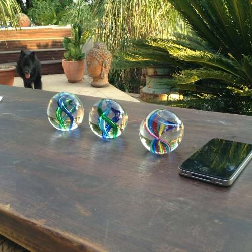 3x glass ball paperweight