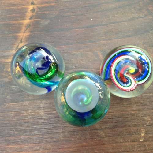 3x glass ball paperweight