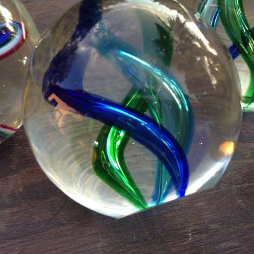 3x glass ball paperweight