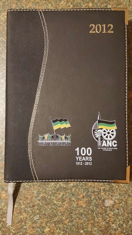 Nelson Mandela Collectors Clad gold medallion, commemorative Diary and Keychain.