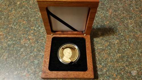 Nelson Mandela Collectors Clad gold medallion, commemorative Diary and Keychain.