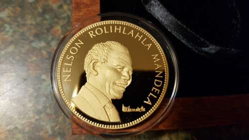 Nelson Mandela Collectors Clad gold medallion, commemorative Diary and Keychain.