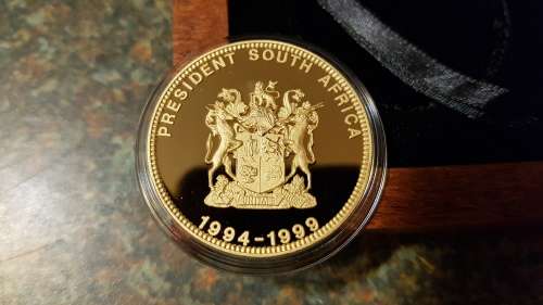 Nelson Mandela Collectors Clad gold medallion, commemorative Diary and Keychain.