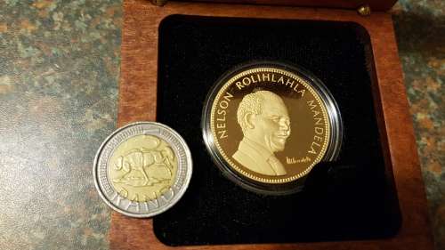 Nelson Mandela Collectors Clad gold medallion, commemorative Diary and Keychain.