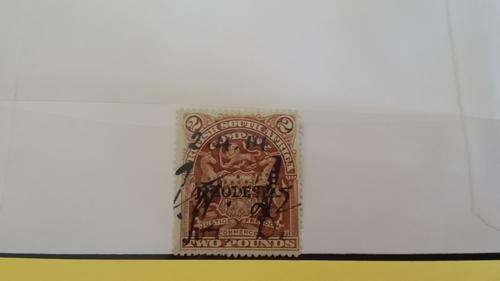 **HOT.HOT!!!1909 BSAC "Rhodesia" overprint. 2 pound brown fiscally used and perforated. Excellent