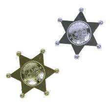 plastic black and silver cowboy badge