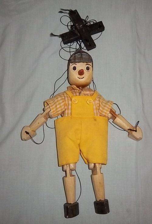 A VINTAGE WOODEN PINOCCHIO PUPPET