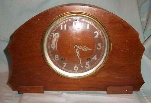 A VERY UNUSUAL MANTLE CLOCK