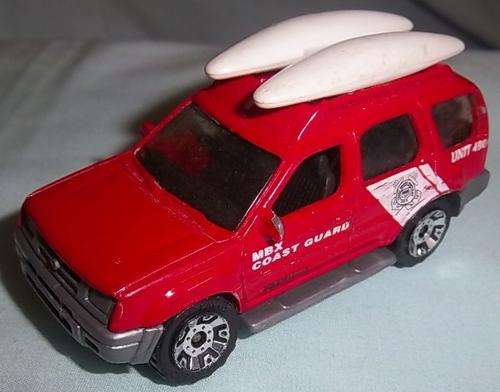 A RED NISSAN XTERRA BY MATCHBOX, 2000