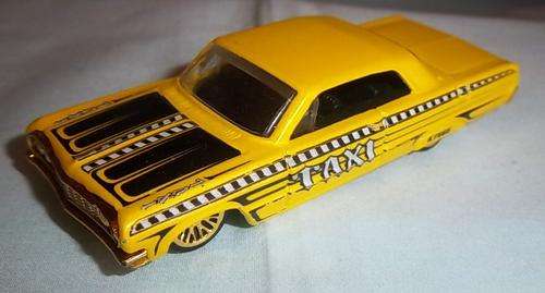 A YELLOW '64 IMPALA TAXI BY HOTWHEELS, 2003