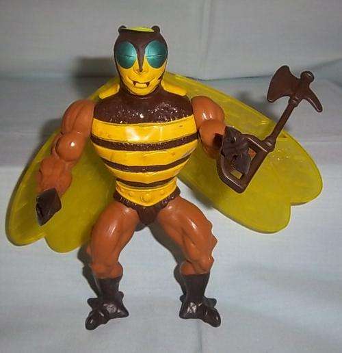 A MOTU BUZZ-OFF FIGURE WITH WEAPON