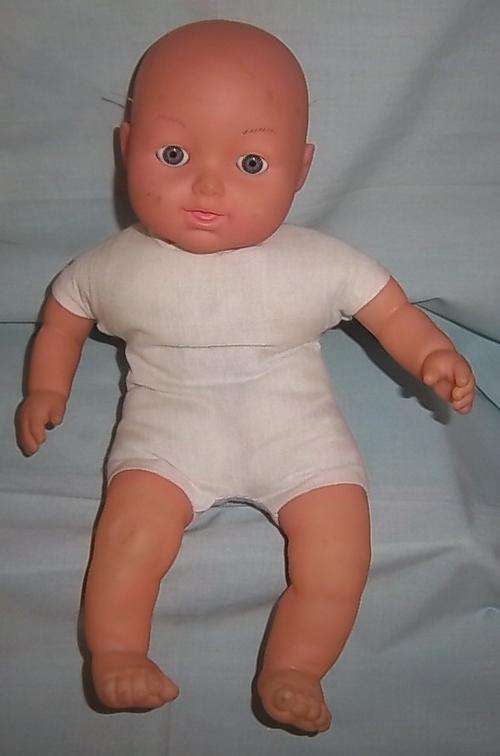 A SOFT BODIED DOLL WITH EYES THAT OPENS AND CLOSES, TALKS AS WELL