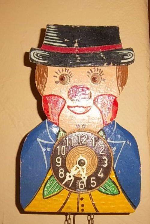 A RARE MOVING EYES CLOWN CLOCK, HAND PAINTED