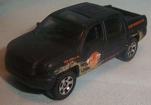 A BLACK HONDA RIDGELINE BY MATCHBOX 2006, MB705