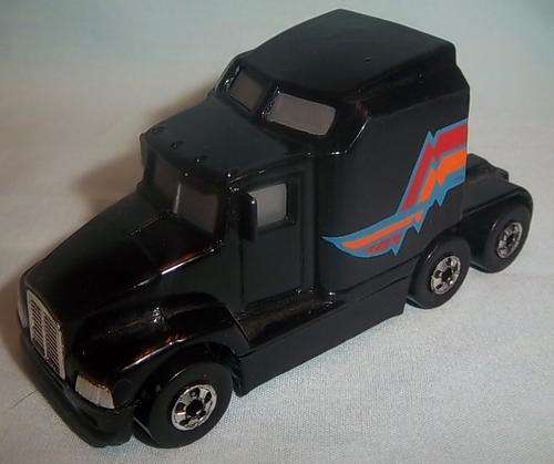 A BLACK 76 BIG RIG BY HOTWHEELS