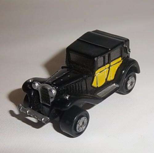A BLACK VINTAGE STYLE CAR BY MICRO MACHINES