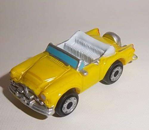 A YELLOW MICRO MACHINES CONVERTIBLE CAR