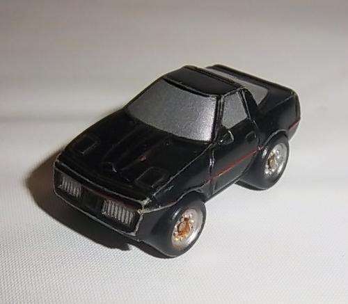 A BLACK CAR BY MICRO MACHINES, ALMOST LOOKS LIKE KID FROM KNIGHT RIDER