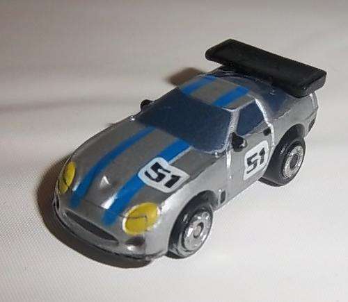 A SILVER RACING CAR WITH NUMBER 51 BY MICRO MACHINES