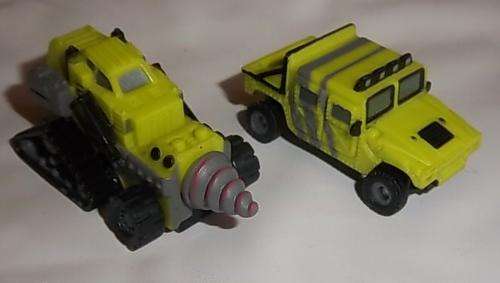 A GREEN HUMMER AND DRILLING VEHICLE BY MICRO MACHINES