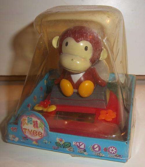 A CUTE MONKEY, HIS HEAD MOVES FROM SIDE TO SIDE, SOLAR POWERED