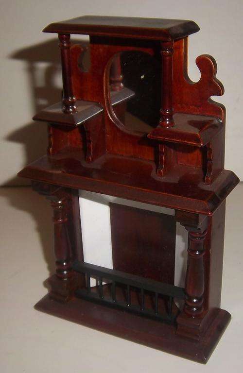 A WOODEN FIRE PLACE FOR A DOLL HOUSE
