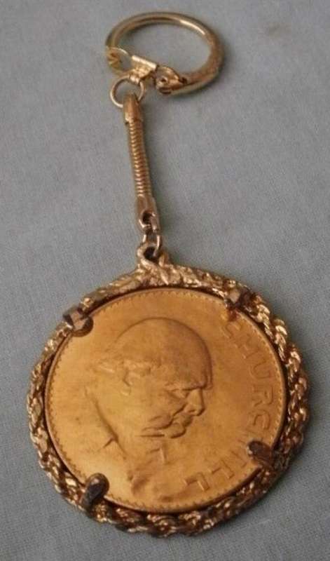 A GOLD PLATED COIN KEY RING