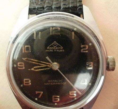 A MONDAINE MECHANICAL MEN'S WRIST WATCH