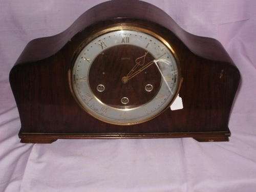 A SMITHS MANTEL CLOCK WITH PAPERS