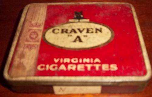 A VINTAGE CRAVEN "A" CIGARETTE TIN WITH SOME ORIGINAL PAPERS INSIDE