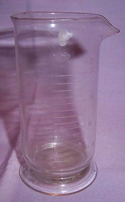 A SMALL SCIENTIFIC MEASURING JUG