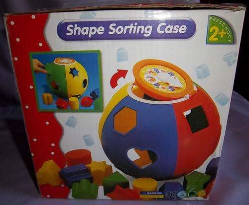 A BOXED ROUND SHAPE SORTING CASE