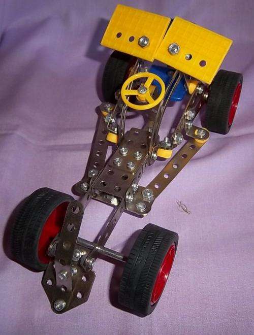 A MECCANO STYLE CAR, NO TOOLS OR EXTRAS, JUST WHAT'S ON THE CAR STARTING ON R1
