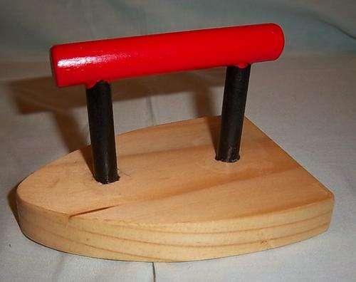 A HAND MADE WOODEN IRON